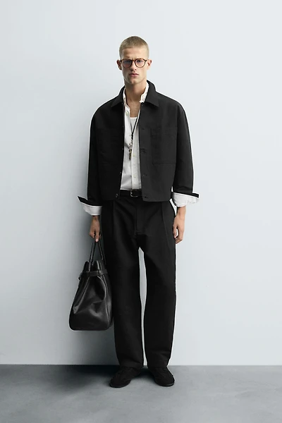 RELAXED FIT PLEATED PANTS