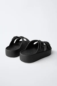 RUBBERIZED BUCKLED SANDALS