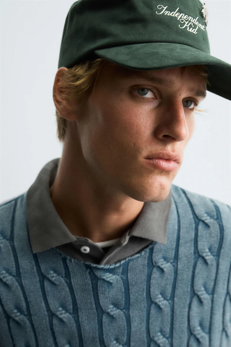 WASHED CABLE KNIT SWEATER
