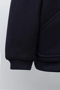 VESTE EN LAINE À POCHES