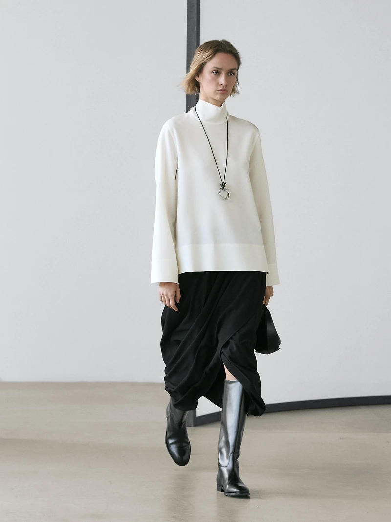 High neck blouse with hem detail