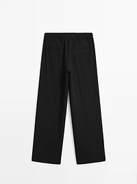 Wide-leg flowing trousers with darts