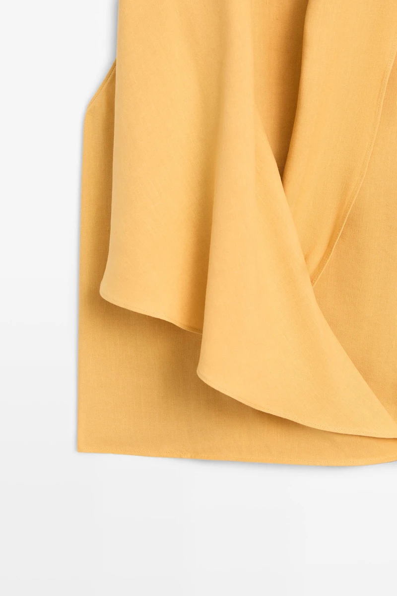 Flowing halter top with ruffle detail