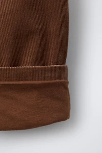 PANTALON EN VELOURS CÔTELÉ BOUTONS DOUBLÉ