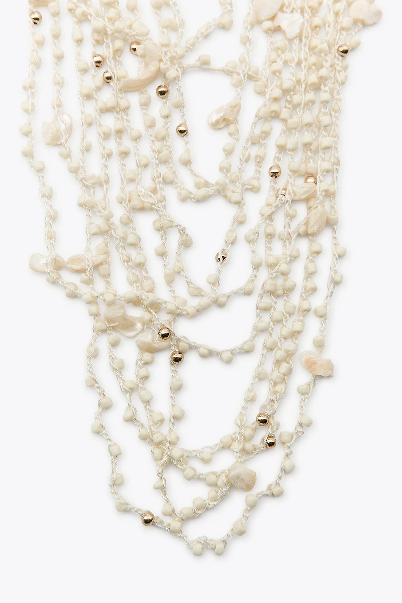 BEADED SHELL BIB NECKLACE