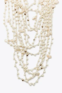 BEADED SHELL BIB NECKLACE