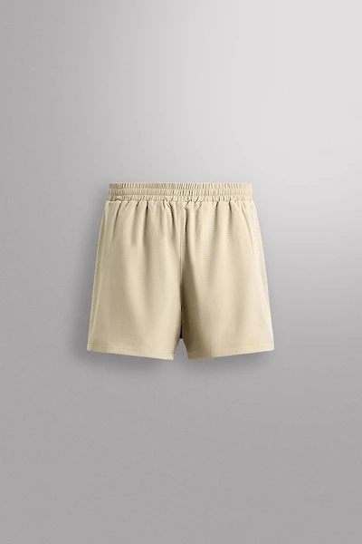 COMBINED PERFORATED SHORTS