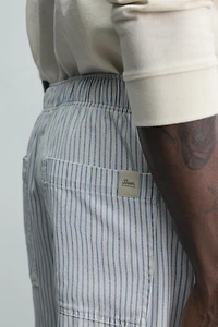 STRIPED BAGGY FIT PANTS