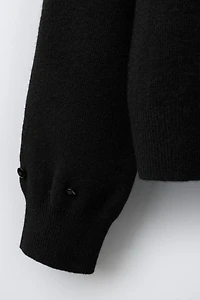 GILET EN MAILLE PLUMES DÉTACHABLES