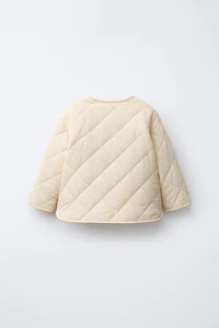 WATER REPELLENT NYLON FAUX SHEARLING JACKET