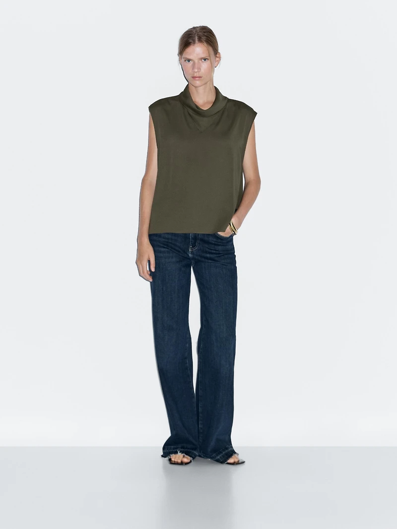Flowing blouse with draped neck detail