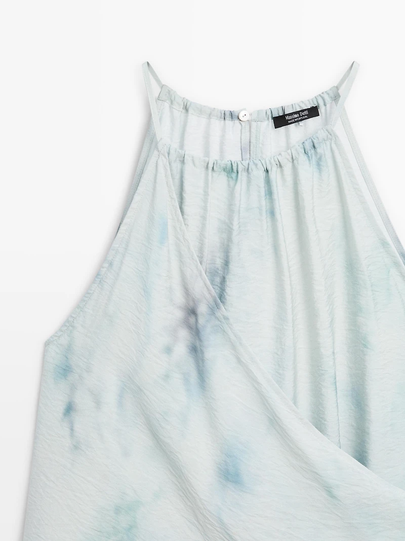 Flowing halterneck top with tie detail