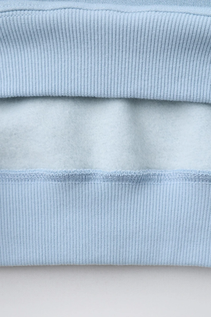 SWEATSHIRT WITH RUFFLED NECK AND EMBROIDERED TEXT