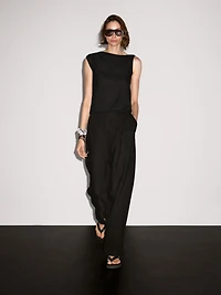 Asymmetric top with knot detail