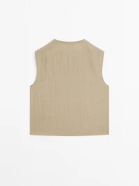 Blouse with silver button fastening on the side