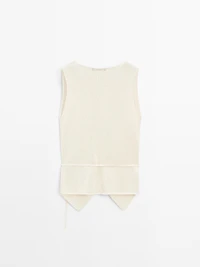 Knit crossover waistcoat with drawstring