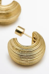Raised design hoop earrings