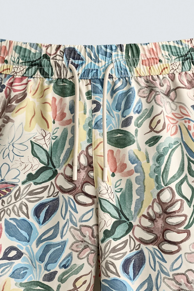 LONG FLORAL PRINT SWIM TRUNKS