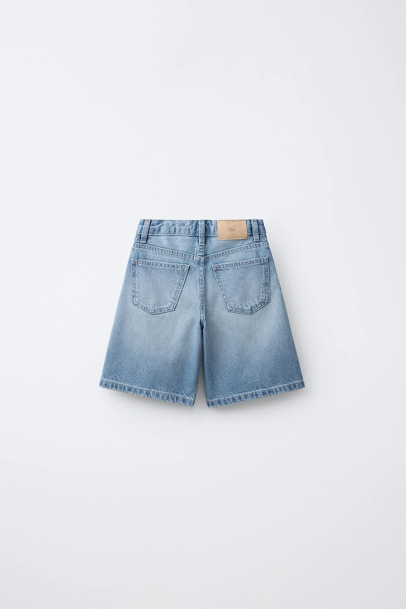 BERMUDA EN JEAN LONGUE STRASS