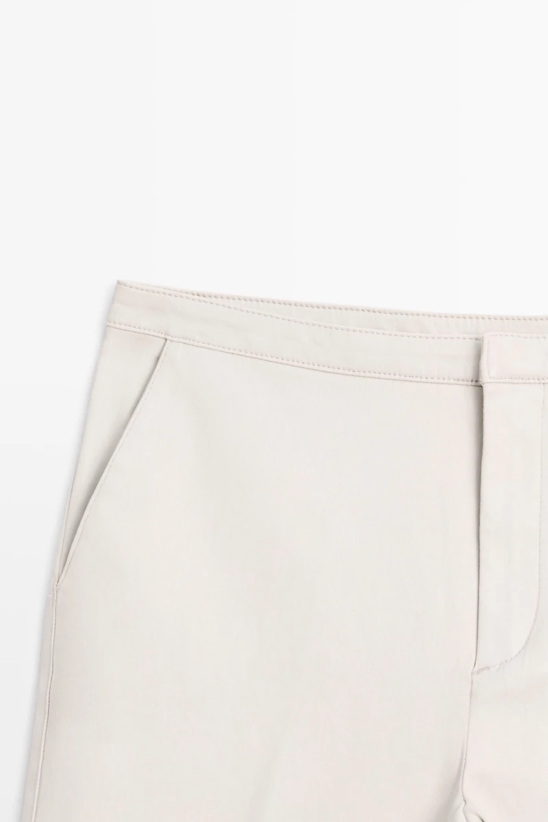 Mid-waist waxed flared pants