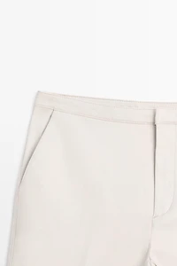 Mid-waist waxed flared pants