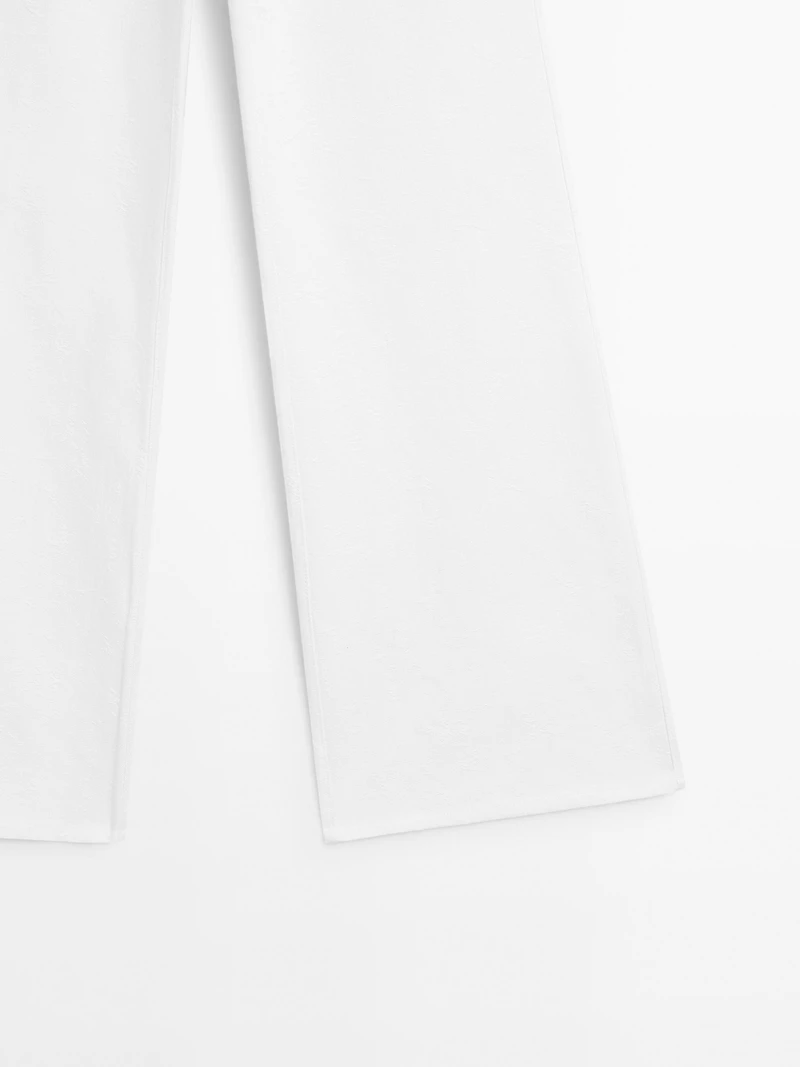 Textured wide-leg denim-effect trousers