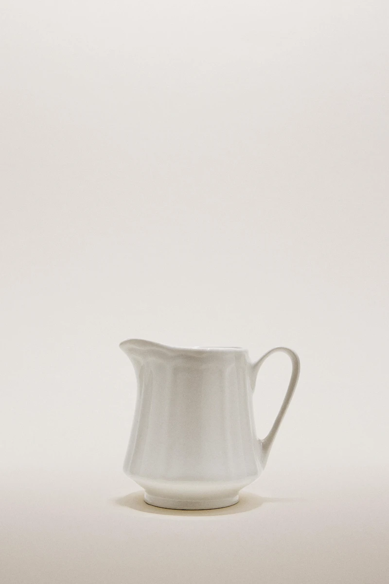 PORCELAIN CREAM PITCHER WITH RAISED PATTERN