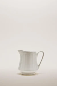 PORCELAIN CREAM PITCHER WITH RAISED PATTERN