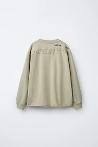 WASHED EFFECT EMBOSSED TEXT T-SHIRT