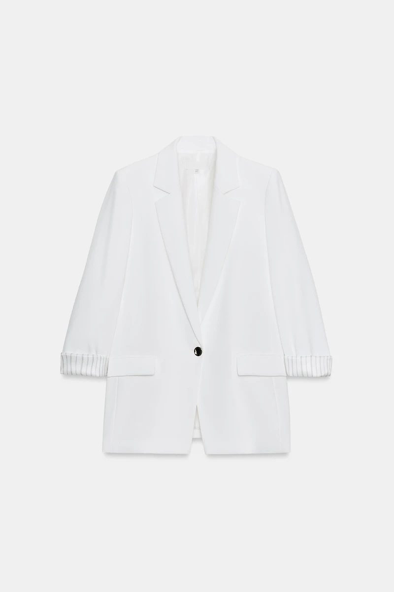 VESTE À MANCHES RETROUSSÉES ET POIGNETS IMPRIMÉS