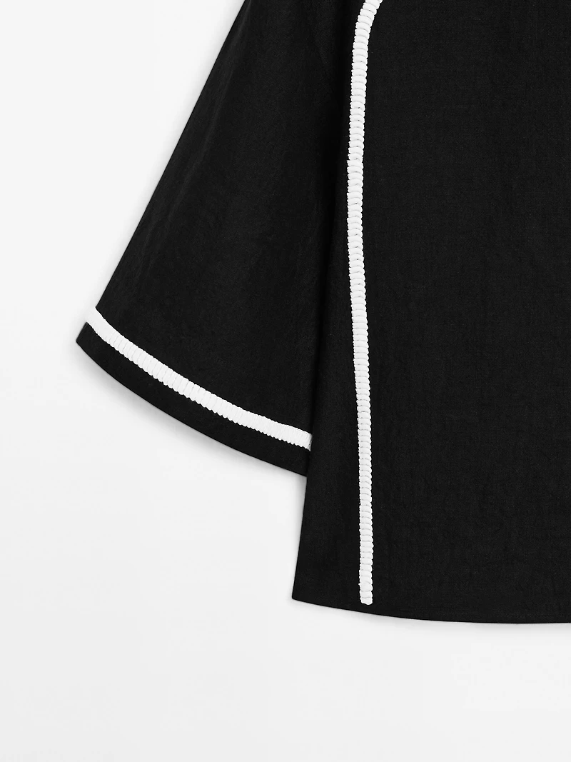 Blouse with contrast embroidery