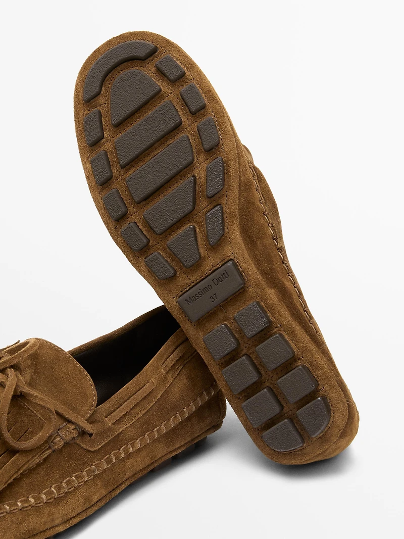 Split suede loafers with fringing and tassels