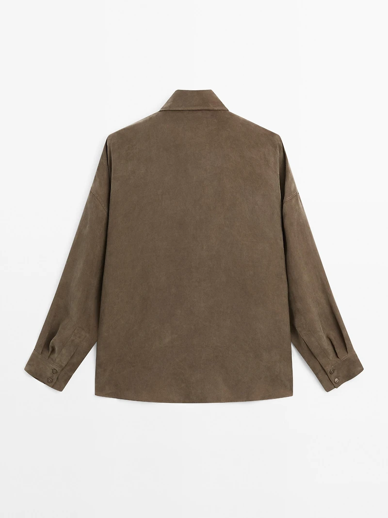 Blouse with zip on the chest