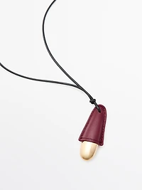 Pendentif pièce en cuir