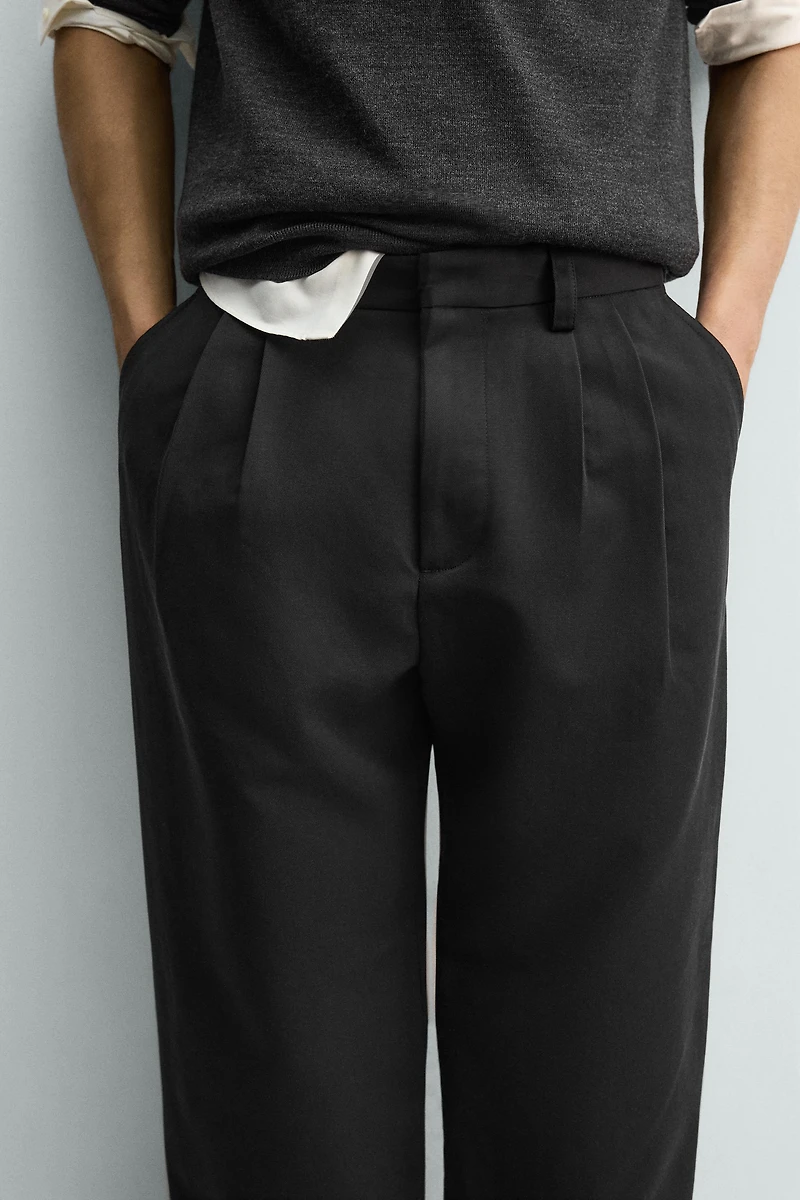 RELAXED BALLOON FIT PLEATED PANTS
