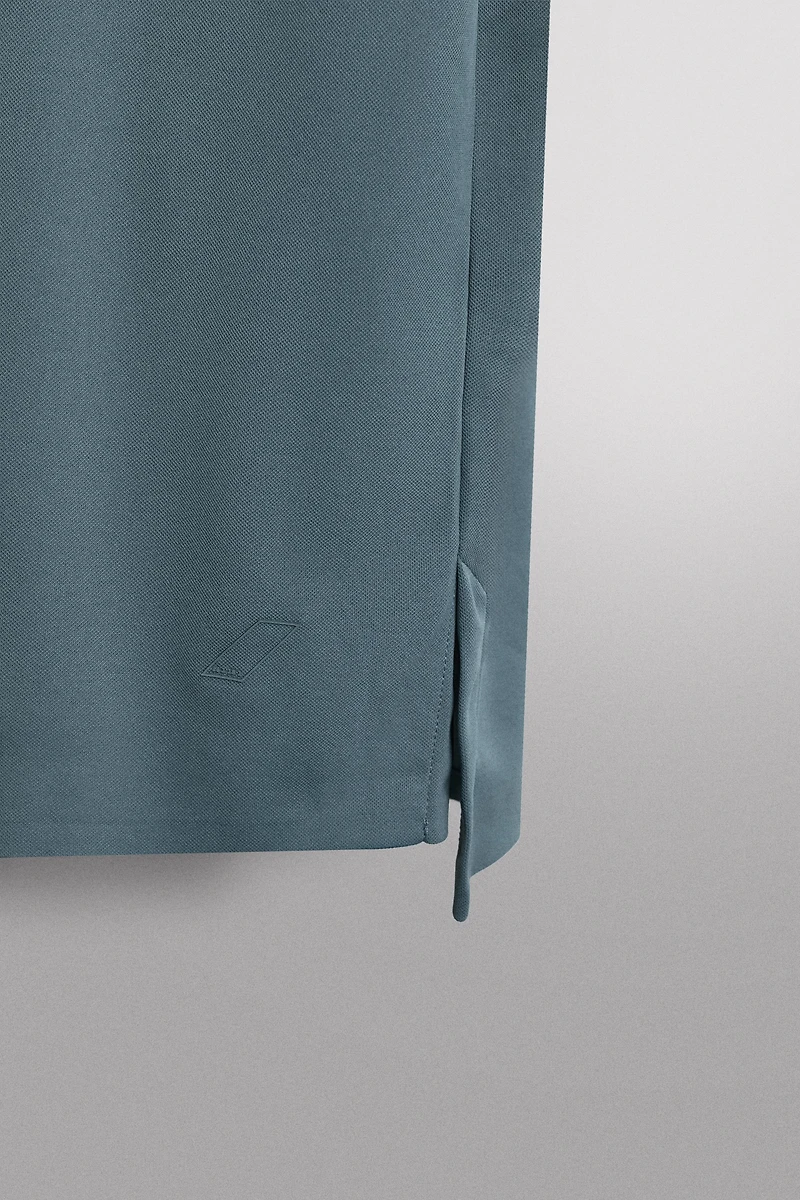 TECHNICAL PIQUÉ TRAINING POLO