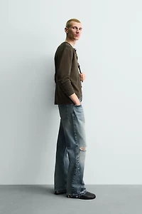 FLARE FIT RIPPED JEANS
