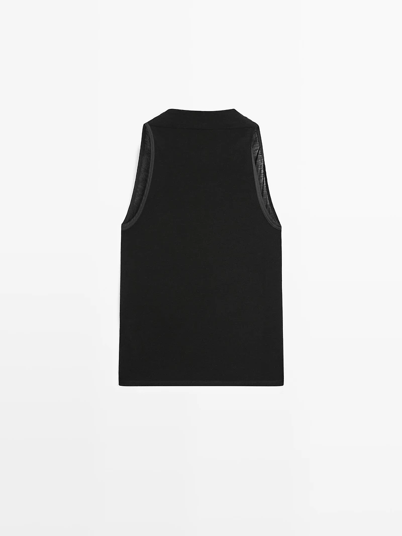 Sleeveless top with draped neckline