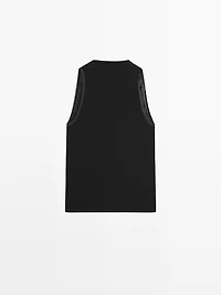 Sleeveless top with draped neckline