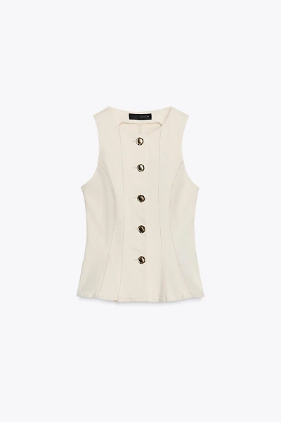 GILET PEPLUM SURPIQÛRES