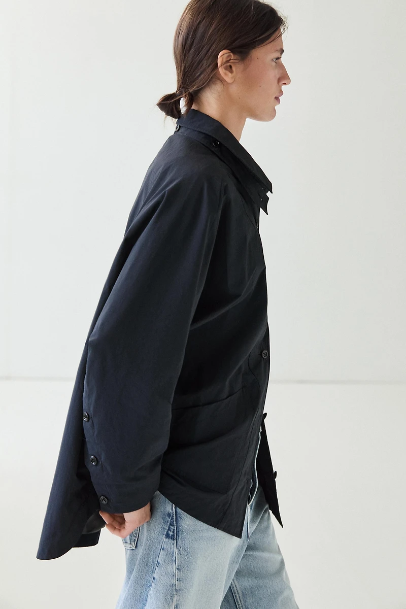 Jacket with buttoned collar strap