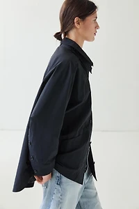 Jacket with buttoned collar strap