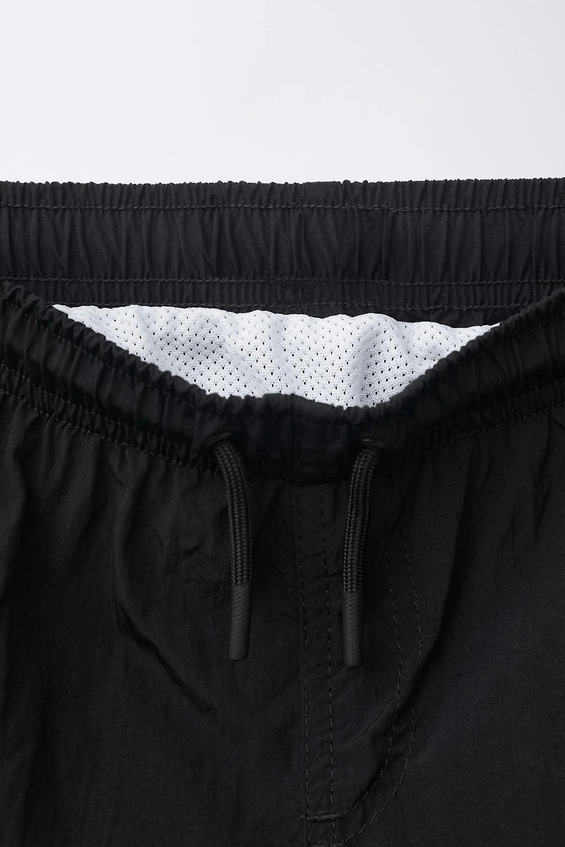 6-14 YEARS/ PLAIN SWIM SHORTS