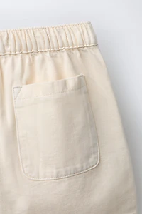 CRISS-CROSS WAIST SHORTS