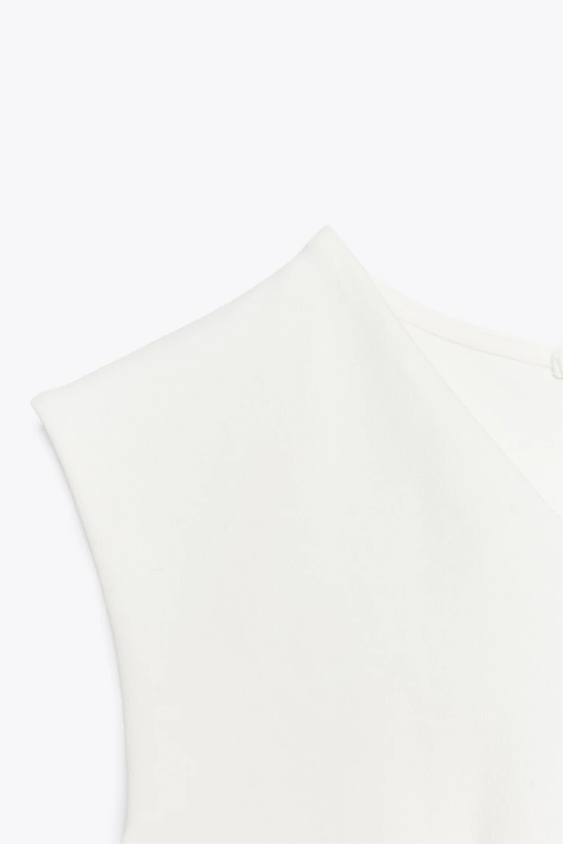 SLEEVELESS INTERLOCK PEPLUM TOP