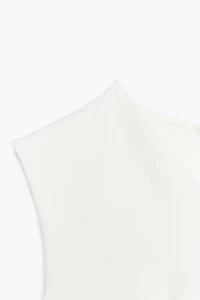 SLEEVELESS INTERLOCK PEPLUM TOP