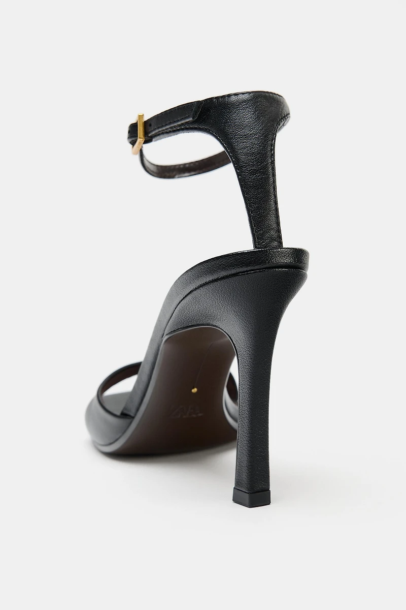 ASYMMETRIC LEATHER HEELED SANDALS