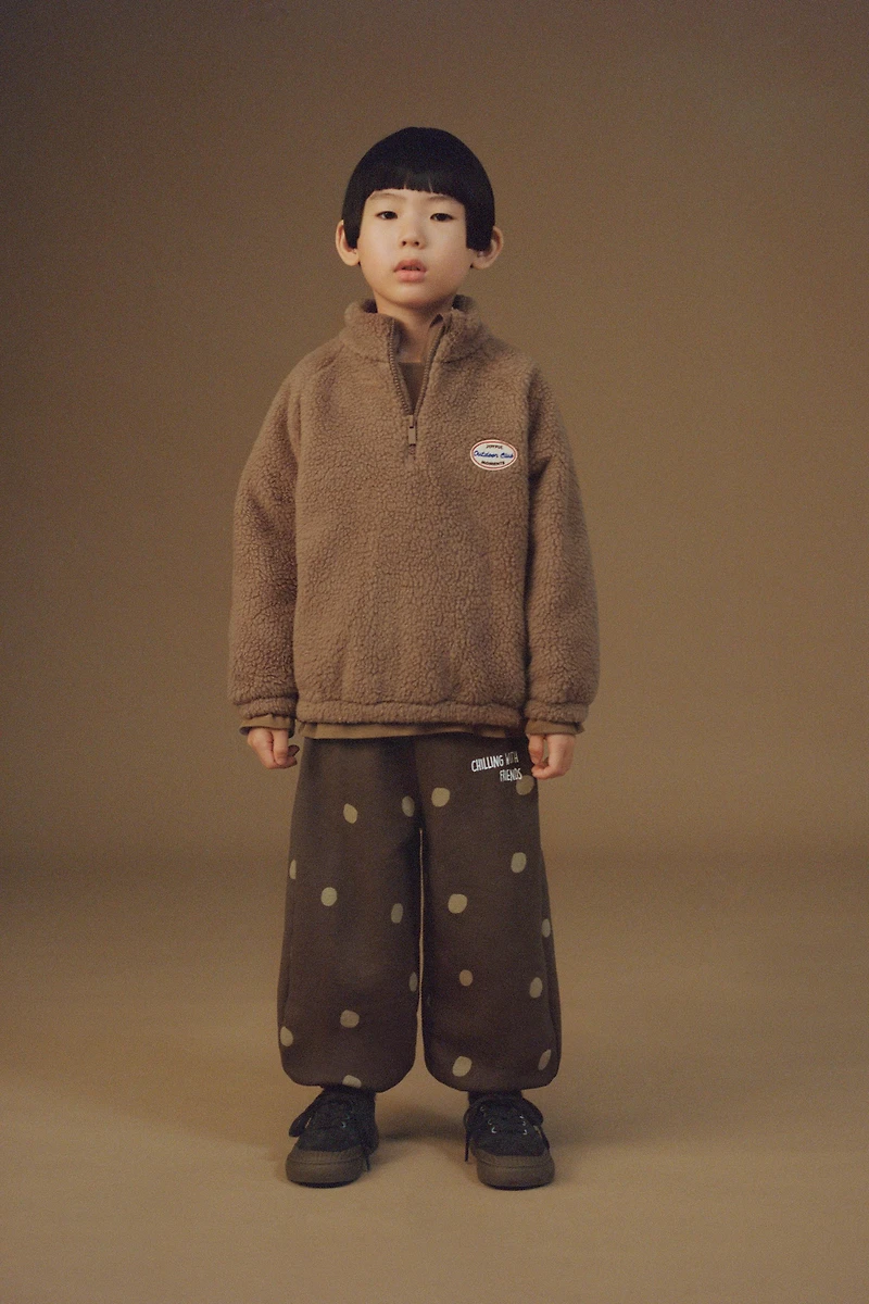 FAUX SHEARLING LABEL SWEATSHIRT