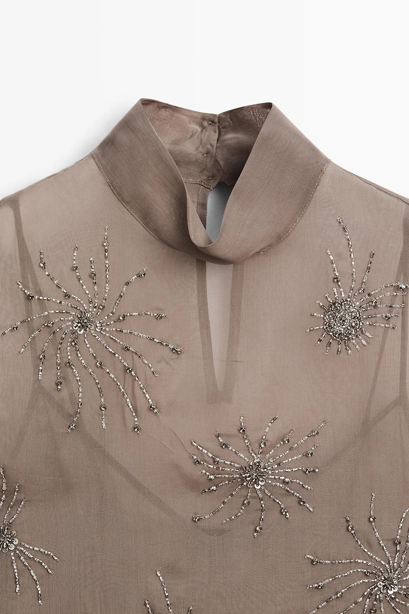 Semi-sheer top with embroidered detail