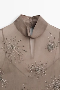 Semi-sheer top with embroidered detail